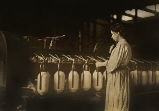 Girl at Spinning Machine, Lincoln Cotton Mills, Evansville, Indiana, USA, Lewis Hine for National Child Labor Committee, October 1908
