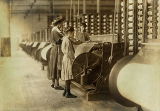 Young Girls Working at Warping Machines at Loray Mill, Gastonia, North Carolina, USA, Lewis Hine for National Child Labor Committee, November 1908