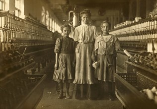 Three Young Workers, Girl on Left said she was 10 years old, girl on Right said she was 12, Rhodes Manufacturing Company, Lincolnton, North Carolina, USA, Lewis Hine for National Child Labor Committee...