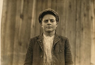 Young Textile Mill Worker, Half-Length Portrait, Dillon, South Carolina, USA, Lewis Hine for National Child Labor Committee, December 1908