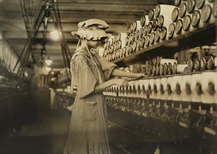 Young Female Spooler, Kesler Manufacturing Company, Salisbury, North Carolina, USA, Lewis Hine for National Child Labor Committee, December 1908