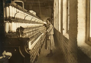 Underage Girl Working as Spinner, Full-Length Portrait, Whitnel Cotton Manufacturing Company, Whitnel, North Carolina, USA, Lewis Hine for National Child Labor Committee, December 1908