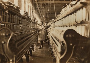 Two Spinners, Full-Length Portrait, Bibb Mill No. 1 Spinning Room, Macon, Georgia, USA, Lewis Hine for National Child Labor Committee, January 1909