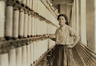 Anna Grenier, at her "Speeder", Chace Cotton Mill, Burlington, Vermont, USA, Lewis Hine for National Child Labor Committee, May 1909