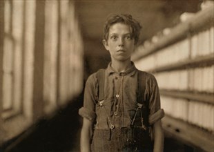 Jo Bodeon, a 'Back Roper" in Mule Room, Half-Length Portrait, Chace Cotton Mill, Burlington, Vermont, USA, Lewis Hine for National Child Labor Committee, May 1909