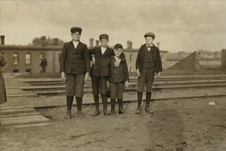 Four Young Boys Employed at Great Falls Manufacturing Company, Full-Length Portrait, Somersworth, New Hampshire, USA, Lewis Hine for National Child Labor Committee, May 1909