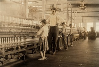 Young Spinners with Supervisor in Yarn Mill, Yazoo City, Mississippi, USA, Lewis Hine for National Child Labor Committee, May 1911