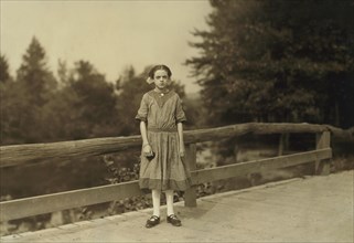 Rosina Goyette, 12 years old, but said she is 14, Full-Length Portrait, Works as Doffer and Spinner at Spring Village Mills, Winchendon, Massachusetts, USA. Lewis Hine for National Child Labor Committ...