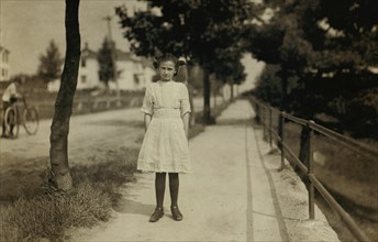 Clerinda Morrin, 11 years old, Full-Length Portrait, Works as Spinner at Glenallen Mills, Winchendon, Massachusetts, USA. Lewis Hine for National Child Labor Committee, September 1911
