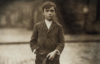 Joseph Philip, Pin Boy at Les Miserables Bowling Alley, Said he was 11 years old, Worked until Midnight every Night, Half-Length Portrait, Lowell, Massachusetts, USA, Lewis Hine for National Child Lab...