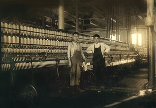 Two Young Boys Working in Mule Room #4, Full-Length Portrait, Wamsutta Mill, New Bedford, Massachusetts, USA, Lewis Hine for National Child Labor Committee, January 1912
