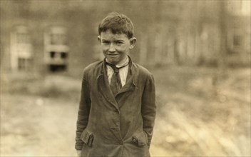 Earl Carpenter, Half-Length Portrait, Young Doffer in Cannon Mill, Concord, North Carolina, USA, Lewis Hine for National Child Labor Committee, October 1912