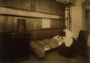 Sick Worker Receiving First Aid, Brym & Marsh, Manufacturer of Electric Bulbs, Pawtucket, Rhode Island, USA, Lewis Hine for National Child Labor Committee, November 1912