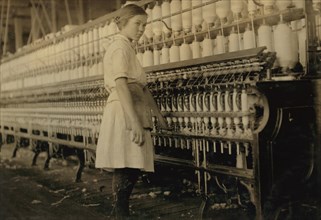 14-year-old Spinner, Full-Length Portrait, Brazos Valley Cotton Mill, West, Texas, USA, Lewis Hine for National Child Labor Committee, November 1913