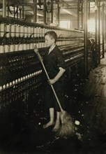 Cleaner and Sweeper, Full-Length Portrait with Broom, Spinning Department, American Linen Company, Fall River, Massachusetts, USA, Lewis Hine for National Child Labor Committee, June 1916