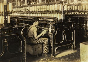 George Courtemonds, 14 years old, Oiler Boy, Oils all Spindles in Spinning Room, King Philip Mills, Fall River, Massachusetts, USA, Lewis Hine for National Child Labor Committee, June 1916