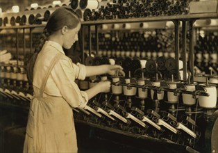 Spooler Tender, 14 years old, Berkshire Cotton Mills, Adams, Massachusetts, USA, Lewis Hine for National Child Labor Committee, July 1916