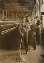 Sweeper, 15 years old, Full-Length Portrait, Spinning and Spooling Room, Berkshire Cotton Mills, Adams, Massachusetts, USA, Lewis Hine for National Child Labor Committee, July 1916