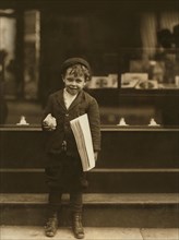 Tommy Hawkins, 5-year-old Newsie, Full-Length Portrait, St. Louis, Missouri, USA, Lewis Hine for National Child Labor Committee, May 1910
