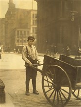 Harvey Nailling, Delivery Boy for Kutterer Printing Company, Portrait Standing with Cart, St. Louis, Missouri, USA, Lewis Hine for National Child Labor Committee, May 1910