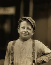 Donald "Happy" Mallick, 9-year-old Newsboy, has been selling Newspaper for 5 years, Half-Length Portrait, Wilmington, Delaware, USA, Lewis Hine for National Child Labor Committee, May 1910