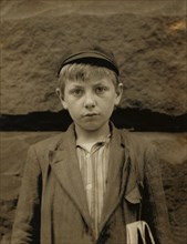 Louis Birch, 12-year-old Newsboy, Works 9 hours per day, Half-length Portrait, Wilmington, Delaware, USA, Lewis Hine for National Child Labor Committee, May 1910