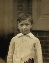 Walter Ray, 8-year-old Newsboy, 1 year of Service, Visits Saloons, Half-Length Portrait, Wilmington, Delaware, USA, Lewis Hine for National Child Labor Committee, May 1910