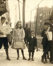 Young Girl and Boys Selling Newspapers on Sidewalk, Wilmington, Delaware, USA, Lewis Hine for National Child Labor Committee, May 1910
