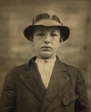 William Gross, 15-year-old Newsboy, has been selling Newspapers for 5 years, Average Earnings 50 cents per week, also Guides Men to Houses of Prostitution, Half-length Portrait, Wilmington, Delaware, ...