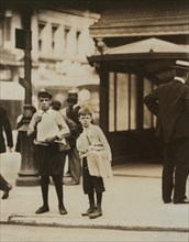 Two Young Newsboys, Full-Length Portrait near Subway Entrance, New York City, New York, USA, Lewis Hine for National Child Labor Committee, July 1910