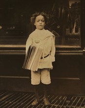 Young Boy, 7 years old, Selling Newspapers, New York City, New York, USA, Lewis Hine for National Child Labor Committee, July 1910