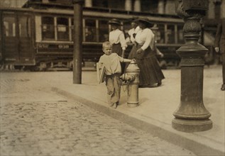 6-yearl-old Newsie, Full-Length Portrait Standing on Sidewalk with Bare Feet, Richmond, Virginia, USA, Lewis Hine for National Child Labor Committee, June 1911