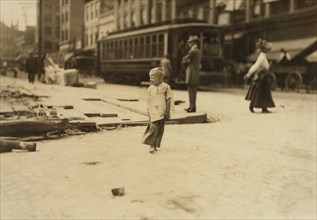 6-yearl-old Newsie, Full-Length Portrait Standing in Street with Bare Feet, Richmond, Virginia, USA, Lewis Hine for National Child Labor Committee, June 1911