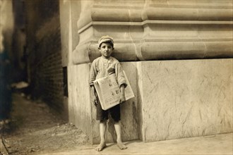 Young Newsboy, Full-Length Portrait Standing in Bare Feet, Norfolk, Virginia, USA, Lewis Hine for National Child Labor Committee, June 1911