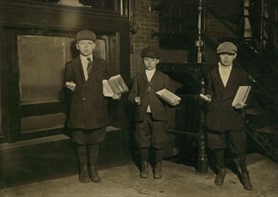 Three Young Boys Selling Gum Near National Theater at Night, Full-Length Portrait, Washington DC, USA, Lewis Hine for National Child Labor Committee, April 1912