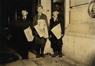 Lawrence Lee, 10 years old, Michael Nyland, 11 years old, Martin Garvin, 12 years old, Full-Length Portrait Selling Newspapers near 14th after Midnight, All vowing to stay until all newspapers were so...