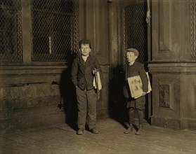 Peter (left), 15 years old, Charles, 11 years old, Employed in Camphor Works, Sells Newspapers Saturday Nights until 3:00 a.m., Full-Length Portrait Selling Newspapers at 1:30 a.m., Newark, New Jersey...