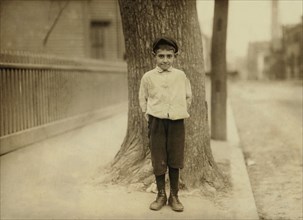 Dominic M. Giouchino, 8 years old, Newsie, Full-Length Portrait, Providence, Rhode Island, USA, Lewis Hine for National Child Labor Committee, November 1912