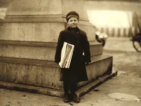 Thomas Messina, 8 years old, Newsboy, Full-Length Portrait, Hoboken, New Jersey, USA, Lewis Hine for National Child Labor Committee, December 1912
