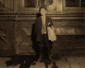Joseph Weiss, 11-year-old Newsboy, Full-Length Portrait Selling Newspapers Late at Night, Newark, New Jersey, USA, Lewis Hine for National Child Labor Committee, December 1912