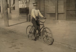 Western Union Messenger, 14 years old, Portrait on Bicycle, Shreveport, Louisiana, USA, Lewis Hine for National Child Labor Committee, November 1913