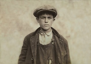 James Donovan, Sweeper at Fall River Iron Works, Half-Length Portrait, Fall River, Massachusetts, USA, Lewis Hine for National Child Labor Committee, June 1916