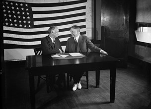 Charles Curtis & Herbert Hoover sitting at Table, American Flag Hanging in Background, Harris & Ewing, 1928