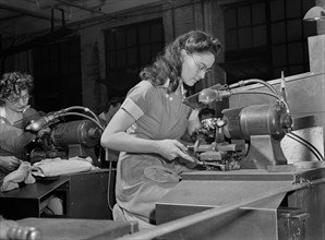 Two Female Factory Workers Operating Machinery, which was Formerly done by Men, at Drill and Tool Plant that Manufactures Drills for use in all War Production Industries, Republic Drill and Tool Compa...