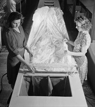 Two Female Workers Threading Shroud Cords through Parachute Fabric, Pioneer Parachute Company, Manchester, Connecticut, USA, William M. Rittase for Office of War Information, August 1942