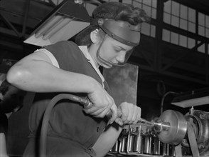 Female Worker Operating Compressed Air Machine at Midwest Aircraft Motor Plant, Ann Rosener, Office of War Information, August 1942