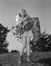 Young Girl Carrying Scrap Metal that she Collected during Scrap Salvage Campaign, Roanoke, Virginia, USA, Valentino Sarra for Office of War Information, October 1942