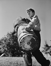 Young Boy Carrying Scrap Metal that he Collected during Scrap Salvage Campaign, Roanoke, Virginia, USA, Valentino Sarra for Office of War Information, October 1942