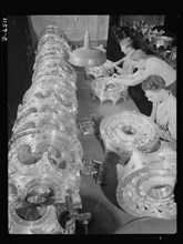 Three Workers Carefully Inspecting Power Section Crank Cases for Airplane Engines at Manufacturing Plant, Pratt & Whitney, East Hartford, Connecticut, USA, Andreas Feininger for Office of War Informat...