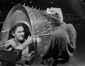 Two Female Riveters Working on B-17F (Flying Fortress), Heavy Bomber, Boeing, Seattle, Washington, USA, Andreas Feininger for Office of War Information, December 1942